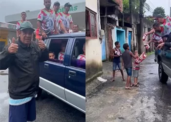 DEBAIXO DE MUITA CHUVA ZECA PAGODINHO DISTRIBUIU OVOS DE PÁSCOA